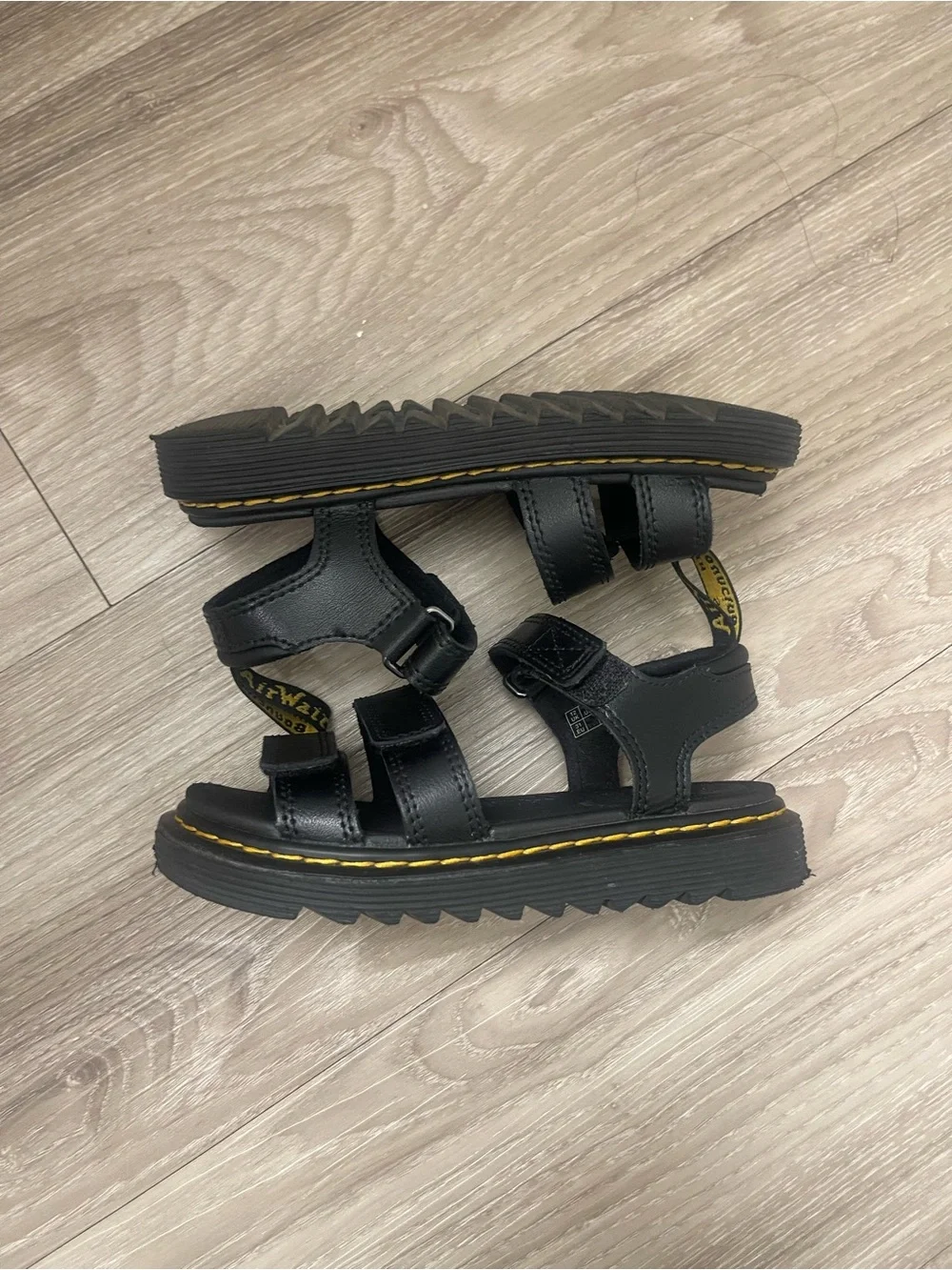 Dr. Martens Kids Black Sandals with Yellow Stitching